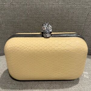 Elegant Cream Clutch with McQueen Skull Accent